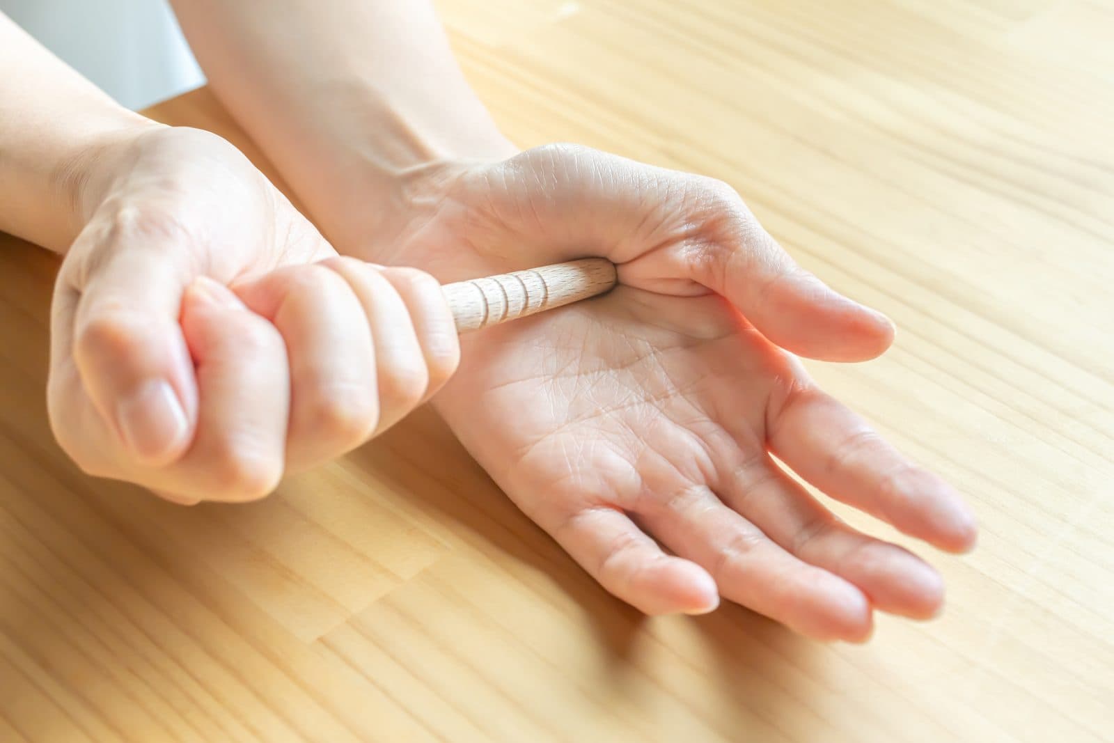 Pressing acupressure points on the palm