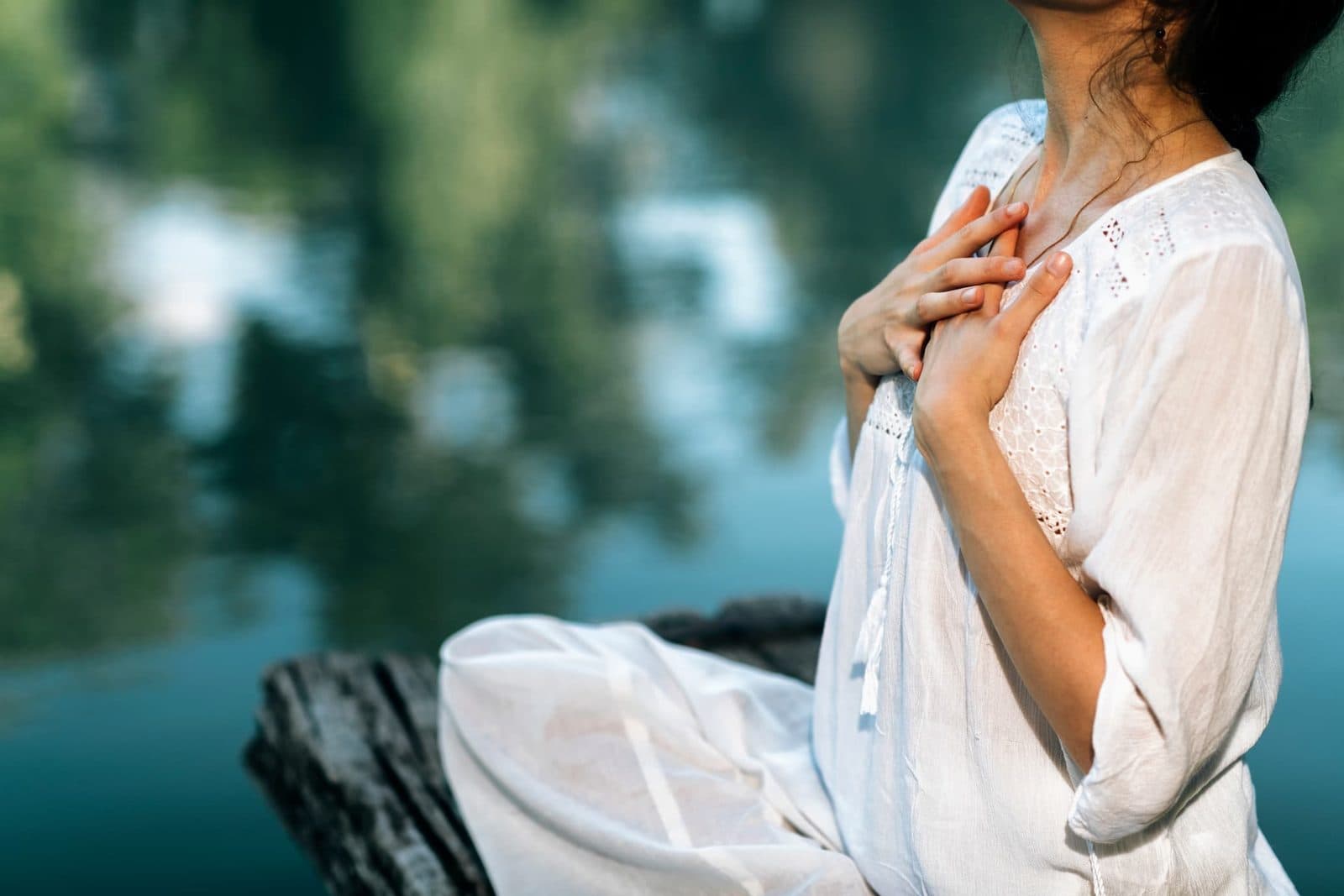Hand resting on the chest to follow the breath