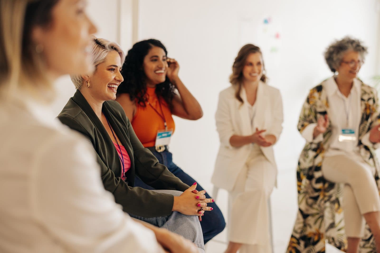 Women laughing together during a workshop
