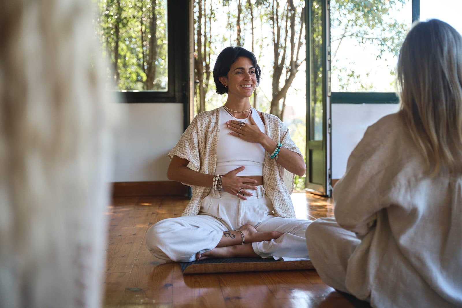 Meditation teacher leading a seated group practice