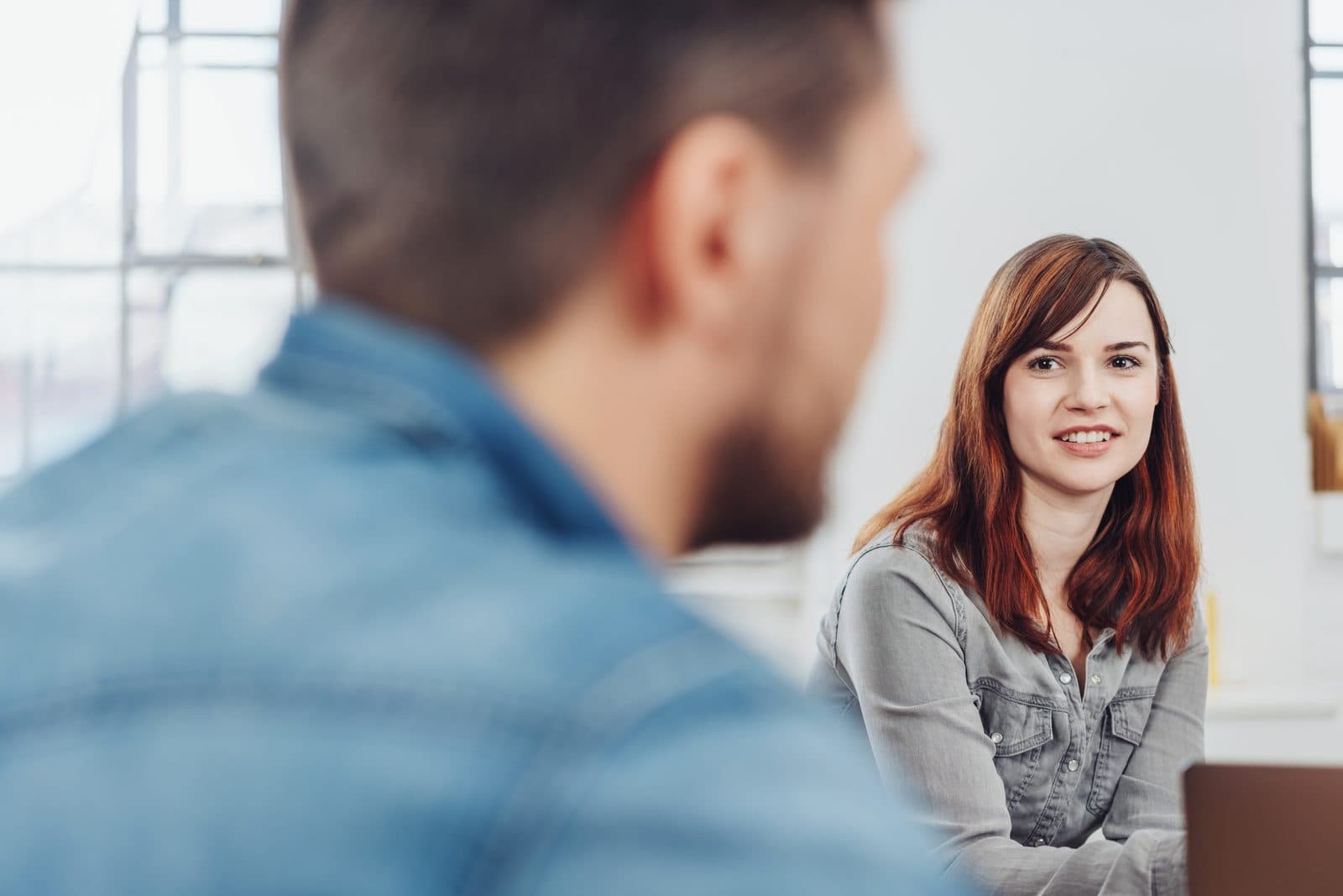 Coach listening closely to a client