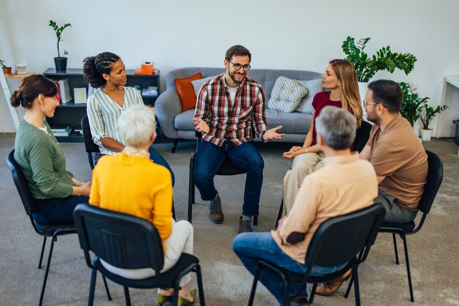 Group seated in a circle during a communication workshop