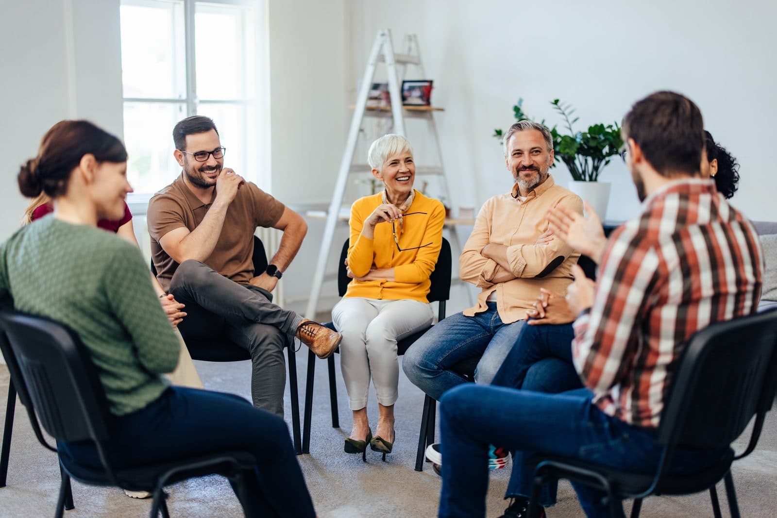 Participants listening to each other in a group circle