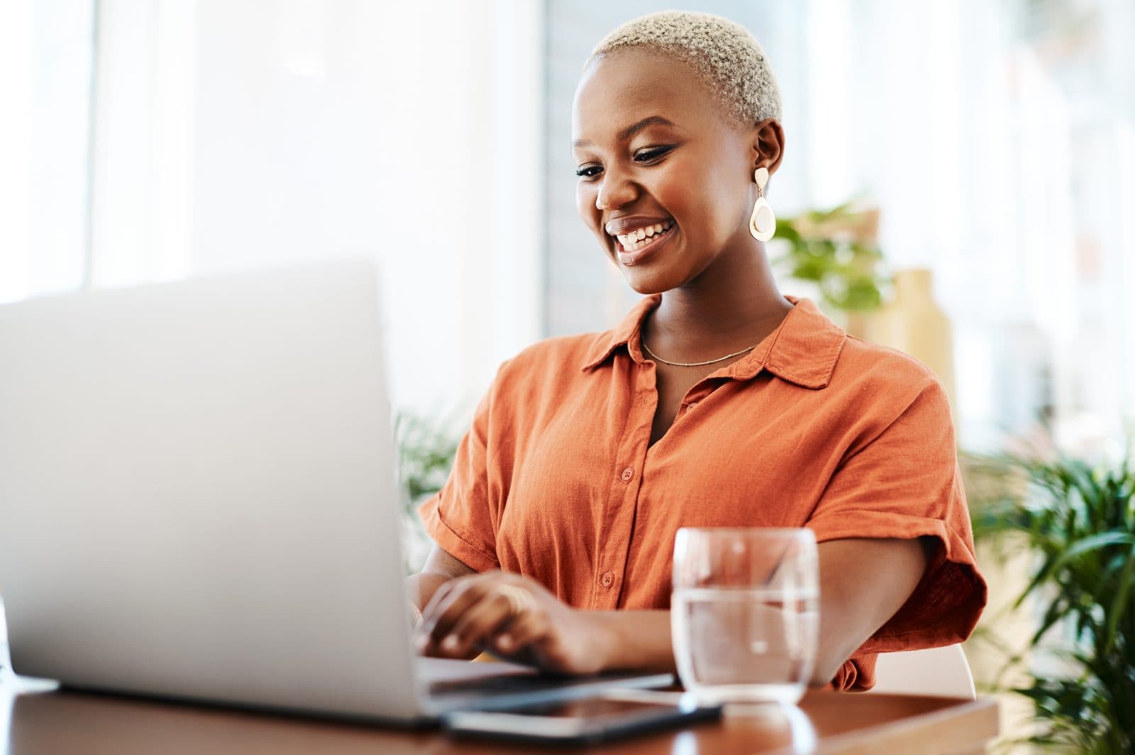 Woman taking part in a live online session from her laptop